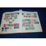 A red Triumph Stamp Album, broad world mix of all periods, well filled with little picking.