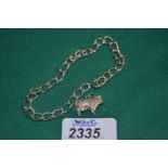 A Silver chain link Bracelet with single Silver charm of a Bull (not attached).