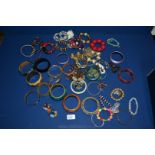 A quantity of colourful bracelets, wooden,