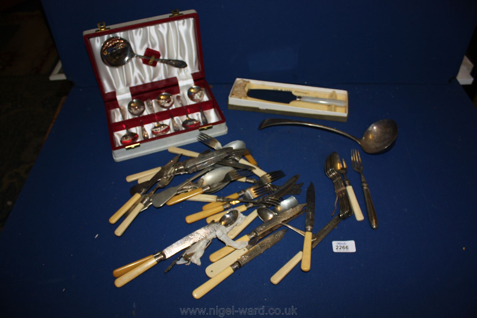 A quantity of assorted plated Cutlery, a ladle, boxed fruit set, and boxed Pie and tart server.