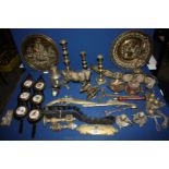 A quantity of Brass including miscellaneous candlesticks, thistle chamber sticks, horse brasses,