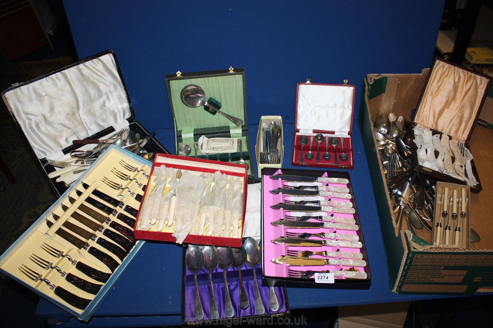 A large quantity of mixed boxed and loose plated cutlery.