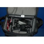 A soft cased Sony Video 8 Handycam Vision with charger, spare battery and three 8mm tapes,