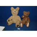 A dark fur jointed 'Boyds Bear', 11'' tall and a jointed, leather pawed bear, one eye missing,