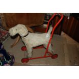 A 1950's Child's Walker Dog on wheels.