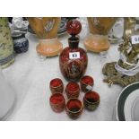 SET OF SIX ENAMELLED OVERLAY LIQUOR GLASSES AND DECANTER,