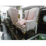 A PAIR OF UPHOLSTERED QUEEN ANNE STYLE WING BACK ARM CHAIRS