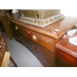 AN OAK SIDEBOARD