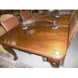 A MAHOGANY QUEEN ANN STYLE DINING TABLE WITH LEAF AND HANDLE