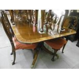 AN EXTENDING REGENCY STYLE DINING TABLE