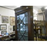 A 19TH CENTURY MAHOGANY CORNER CABINET