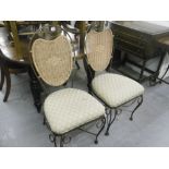 A PAIR OF METAL CHAIRS