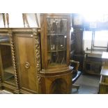 A MAHOGANY GLAZED CORNER CABINET