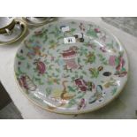 A CHINESE PORCELAIN FAMILLE ROSE CELEDON WARE PLATE