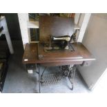 A SINGER TREADLE SEWING MACHINE TABLE