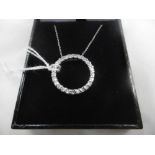 A SILVER AND DIAMOND PENDENT ON CHAIN