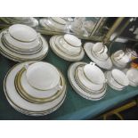 A GOLD AND CREAM PART DINNER SET,