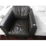 A LEATHER ARMCHAIR