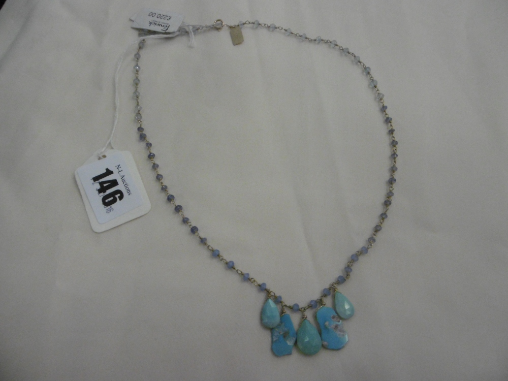 A CONTEMPORARY NECKLACE WITH SEMI PRECIOUS STONES