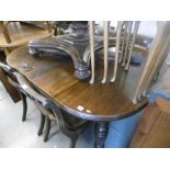 A VICTORIAN EXTENDING TABLE ON TURNED LEGS