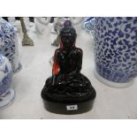 A GLASS BUDDHA OIL LAMP