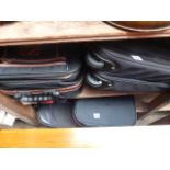 Shelf of mixed suitcases