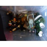 Box of full and part filled alcohol bottles