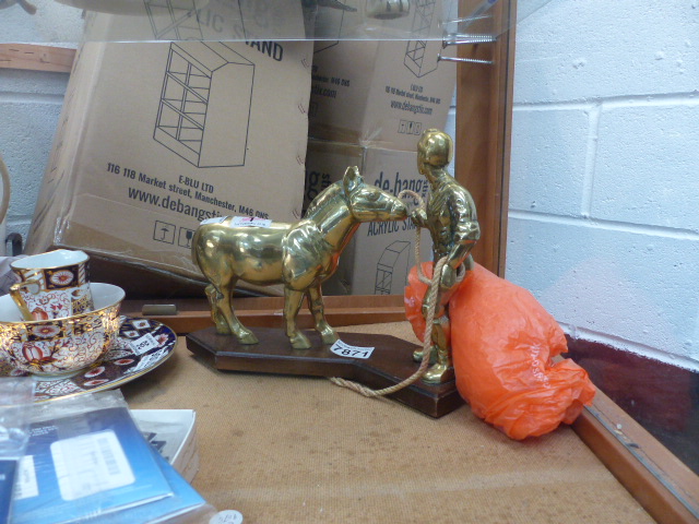 Brass figurine of Man and Horse on wooden plinth