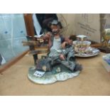 Capodimonte figurine of tramp on bench, H ~ 22cm