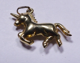 GOLD UNICORN CHARM. 9ct gold unicorn charm / pendant