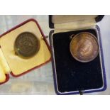 CASED LIFE SAVING MEDALS. Two cased life saving medals