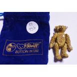 MINIATURE STEIFF BEAR. Miniature metal jointed Steiff teddy bear