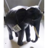 EBONY ELEPHANT. Ebony elephant with ivory tusks