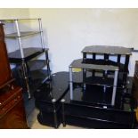 GLASS TV STANDS. Eight black glass TV stands