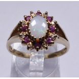 GOLD THREE STONE RING. 9ct yellow gold opal, ruby and diamond ring, size S/T