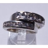 TWO SILVER RINGS. Two diamante set 925 silver rings