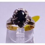 GOLD VINTAGE CLUSTER RING. 18ct gold vintage 1978 sapphire and diamond cluster ring, size I/J