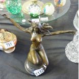 BRONZE NUDE. Bronze nude squatting on globe, H ~ 26cm