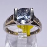 GOLD AQUAMARINE AND DIAMOND RING. 14ct white gold aquamarine and diamond ring, size N