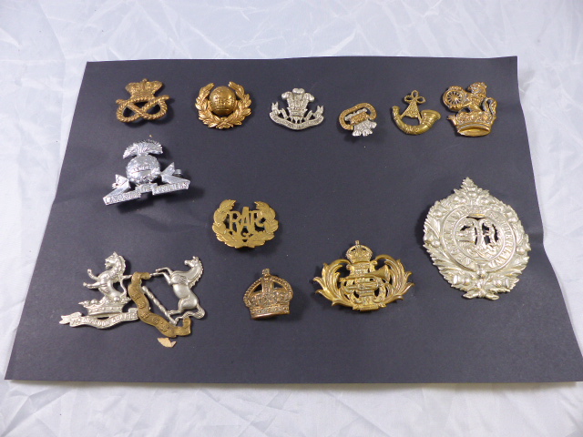 MILITARY INSIGNIA. Selection of Military cap and collar insignia from WWI and WWII