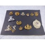 MILITARY INSIGNIA. Selection of Military cap and collar insignia from WWI and WWII