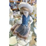 LLADRO FIGURINE. Lladro figurine of young girl with basket of flowers