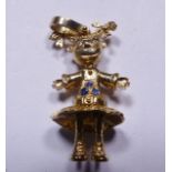 GOLD ARTICULATED DOLL PENDANT. 9ct gold articulated doll with pigtails pendant