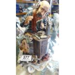 CAPODIMONTE FIGURINE. Capodimonte figurine of man sewing F23, signed