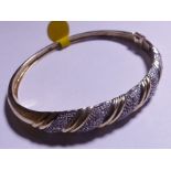 GOLD AND DIAMOND BANGLE. 9ct gold 0.50ct diamond bangle