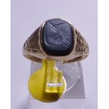9CT GOLD RING. 9ct gold intaglio haematite ring, size S/T