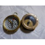 TWO BRASS COMPASSES. Two brass compasses, Henry Hughes