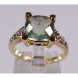 9CT PREHNITE AND TOPAZ RING. 9ct gold prehnite and white topaz ring, size N