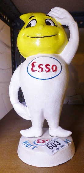 CAST IRON MONEYBOX. Cast iron Esso man moneybox, H ~ 25cm