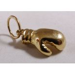 9CT BOXING GLOVE. 9ct gold solid boxing glove pendant